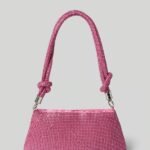 Textured pattern handbag with pink shoulder strap